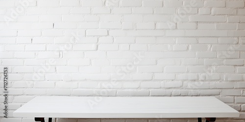 White brick wall background with an empty table.