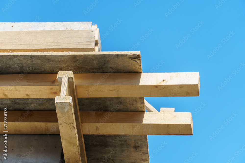 An outdoor construction site. Construction of a new building. Block construction, reinforced concrete beams and wooden floors and roofs. An outdoor construction site. Construction of a new building. Block construction, reinforced concrete beams and wooden floors and roofs.