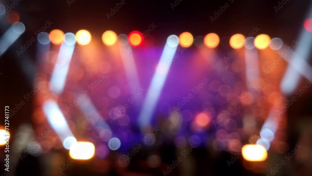 Stage lights at the music festival, colorful defocused background