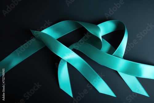 Teal awareness ribbon Ovarian Cancer, cervical cancer, Obsessive Compulsive Disorder (OCD), Polycystic Ovary Syndrome (PCOS) disease, Post Traumatic Stress Disorder (PTSD) photo