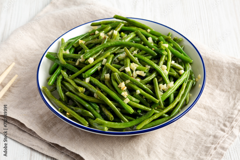 Homemade Asian Garlic Green Beans on a Plate, side view. Homemade Asian Garlic Green Beans on a Plate, side view.