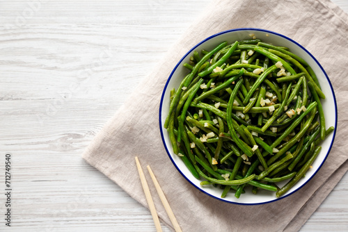 Homemade Asian Garlic Green Beans on a Plate, top view. Flat lay, overhead, from above.