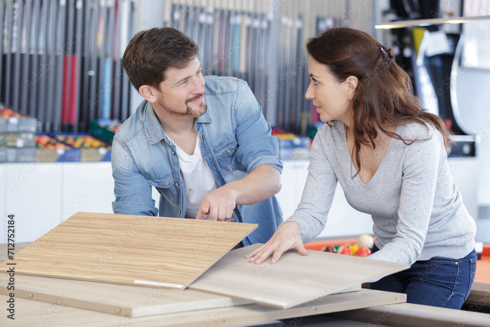 Fototapeta premium a couple choosing material for new apartment