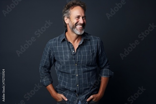 Handsome middle-aged man in a plaid shirt.