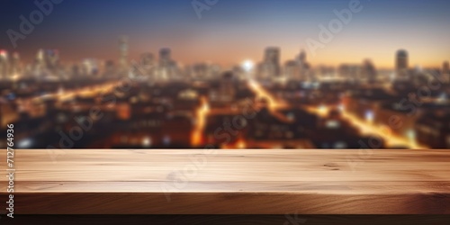 Wooden countertop on a blurred city lights background  suitable for product editing.