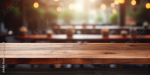 Wooden table top with coffee shop interior background, ideal for product display. © Sona