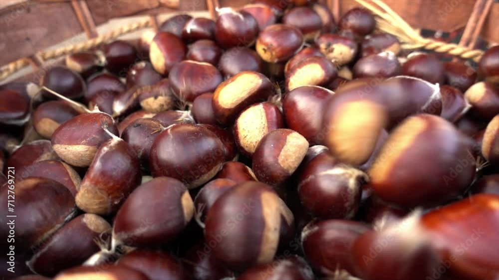 Autumn composition of chestnuts, hedgehogs and chestnut leaves. Fall season. Warm colors. Food background Autumn composition of chestnuts, hedgehogs and chestnut leaves. Fall season. Warm colors. Food background