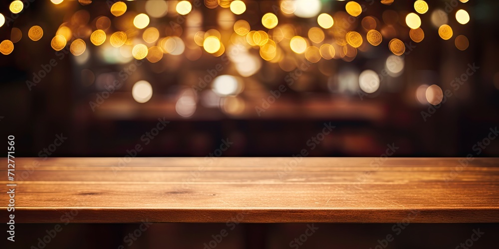 Bokeh in a dark cafe, bar, or restaurant with a wooden table top, representing lifestyle and celebration. Bokeh in a dark cafe, bar, or restaurant with a wooden table top, representing lifestyle and celebration.