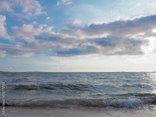 Sea view from tropical beach with sky Tropical coast, tropical sea, summer beach with clouds on the horizon, sea, beach, relax, outdoor travel