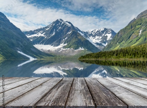 Empty pier on the lake with space for product display or copy text  with mountains on the background. Travel concept.