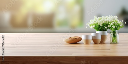 Create a visually captivating arrangement for product presentation using a blurred kitchen as the background with a wooden table top.