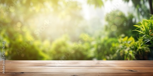 Wood table top with blurred view of green garden through window in the morning, suitable for product display or visual design layout.