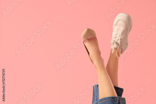 Female legs wearing sneaker...