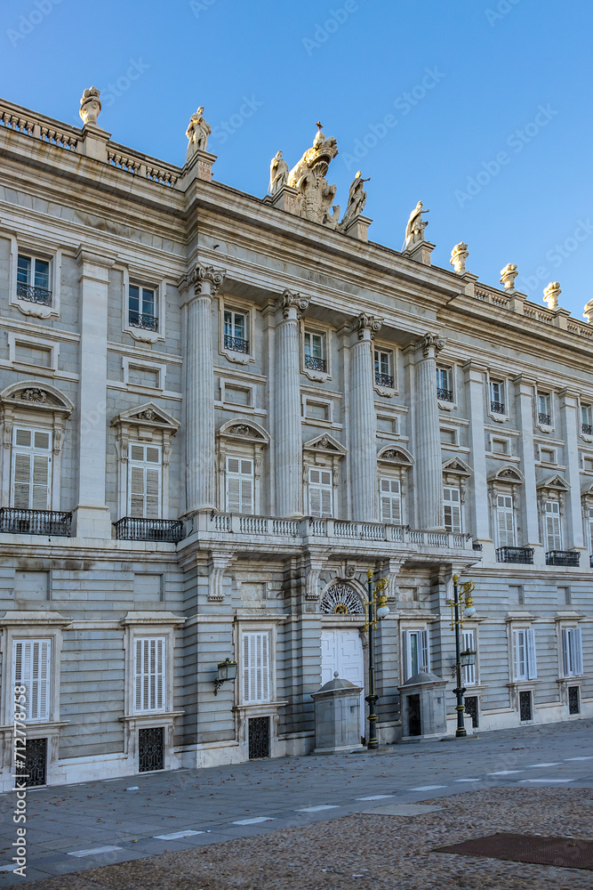 Architectural fragment of Spanish Royal Palace (Palacio Real, 18th century) in Madrid - official residence of the King of Spain, largest palace in Europe by floor area. Madrid, Spain.