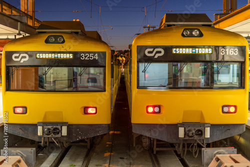 Yellow public transport train bound for Cais do Sodré stopped at Cais do Sodré train station in Lisbon-portugal photo