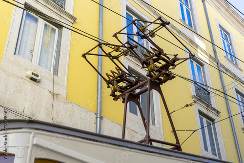 detail plan of the pantograph that passes electricity to the old Bica elevator car in the city of Lisbon. photo