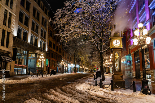 Vancouver, British Columbia - Canada. Downtown iconic landmark on a snowy night just after a snowstorm, the Steam Clock, Gastown- Vancouver, British Columbia, Canada.