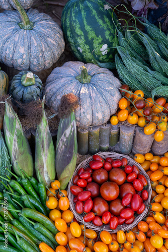 Wallpaper Mural Closeup with top view, Vegetables, and Fruits patterns. Decorate with many types of vegetables and fruits. Nature vibrant fruits including tomatoes decorate the background. Torontodigital.ca