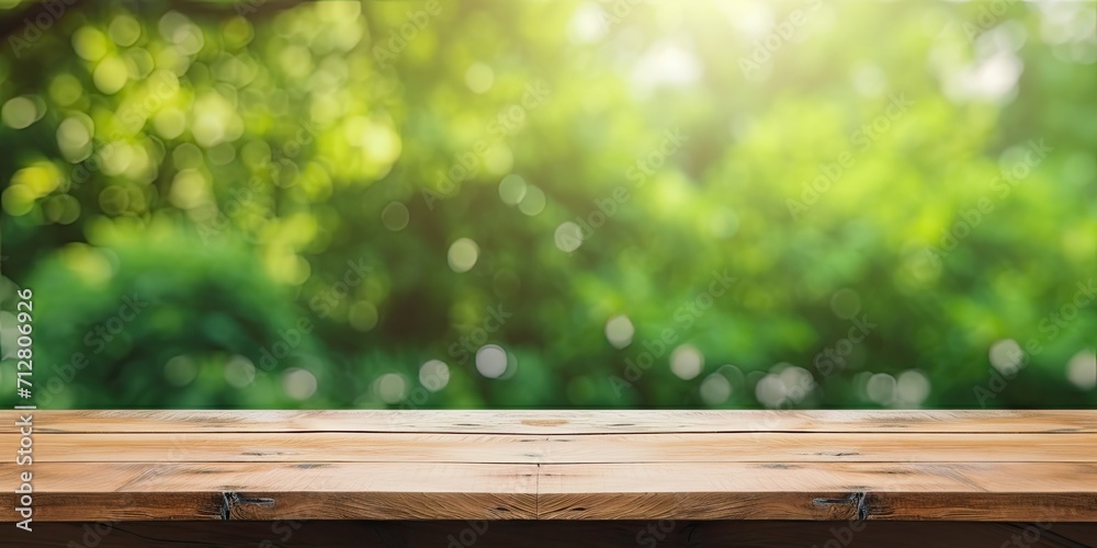 Wooden table with a blurred green backyard for an ad template. Wooden table with a blurred green backyard for an ad template.