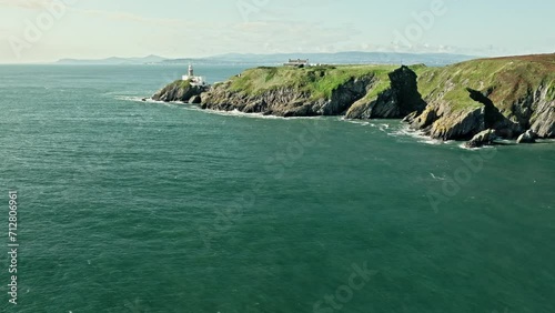 lighthouse on top of a cliff, landscape, aerial view photo