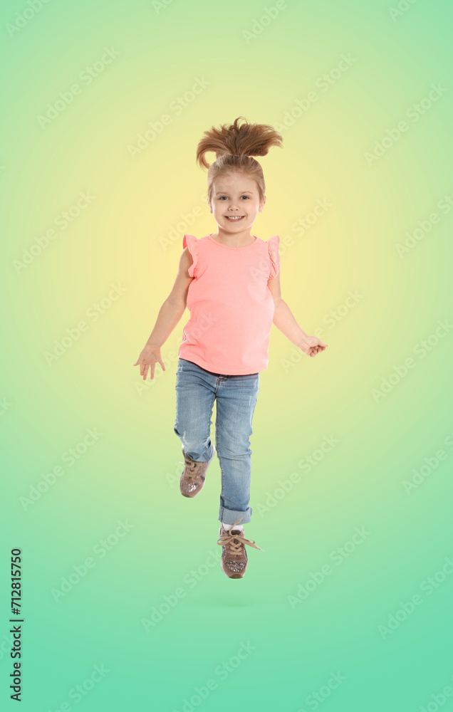 Happy cute girl jumping on color gradient background Happy cute girl jumping on color gradient background