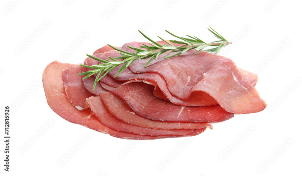 Slices of tasty bresaola and rosemary isolated on white Slices of tasty bresaola and rosemary isolated on white