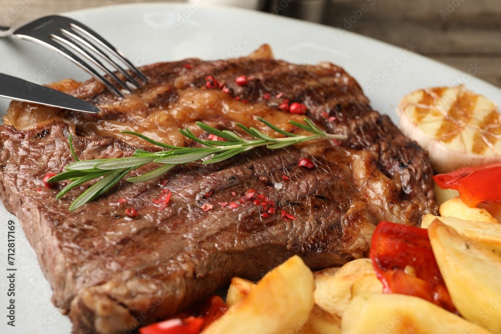 Delicious grilled beef steak and vegetables on plate, closeup Delicious grilled beef steak and vegetables on plate, closeup