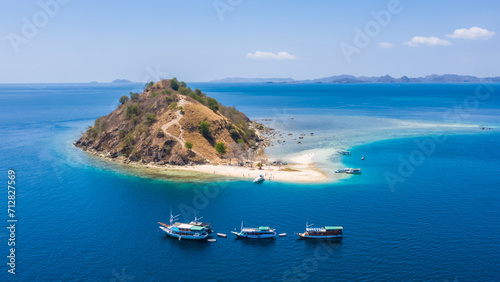 Aerial view of beaches and tourist boat sailing in Kelor Island, Flores Island, Indonesia
