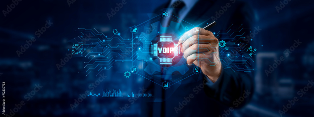 Φωτογραφία VoIP Concept: Businessman Pointing at VoIP Icon and Data for Global Communication Network on Graphic Interface
