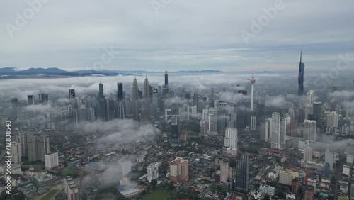 Captivating scene Kuala Lumpur city view with low-hanging clouds
