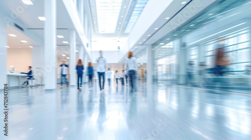 Blurred modern hospital people in white glass modern hospital background.