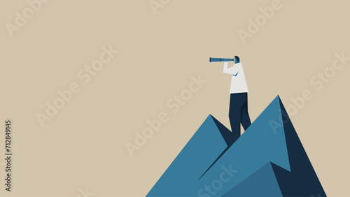 A man checks his surroundings through a telescope from the top of a mountain.