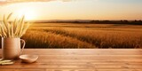Product montage featuring wooden deck table and wheat field at sunrise or sunset.