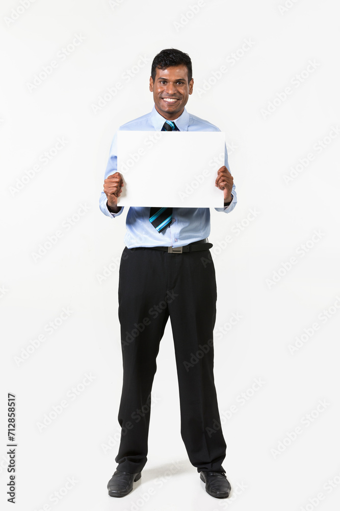 Indian man holding up a banner. Indian man holding up a banner.