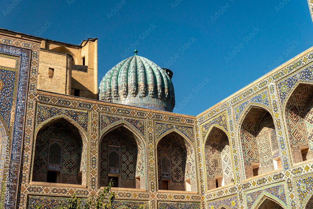 Colorful exterior of tilya-kori madrasah, Samarkand Registan. Colorful background