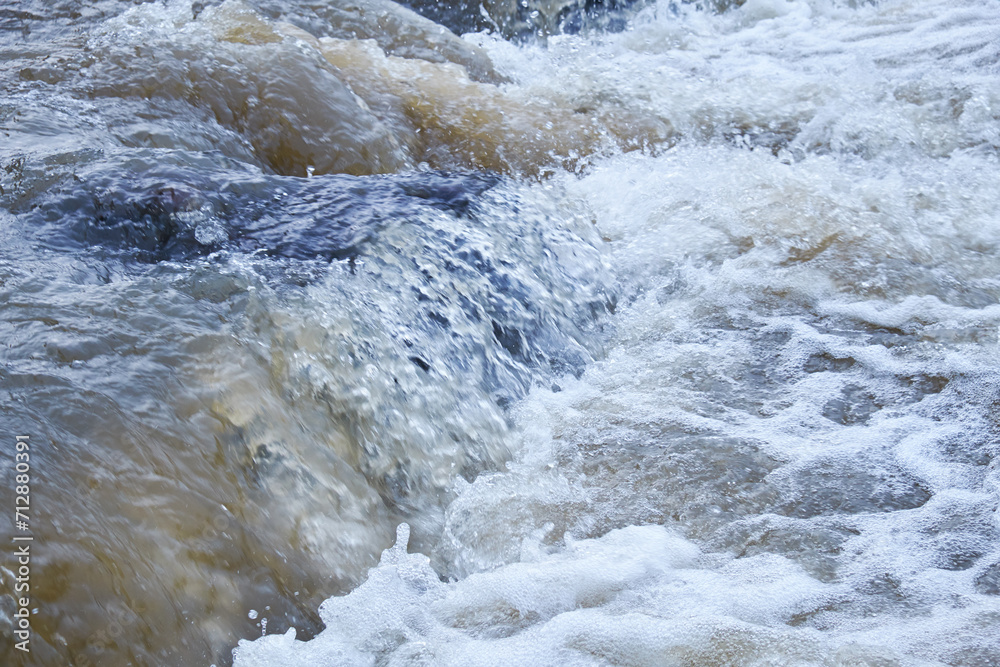 Altai river Katun in Spring season. Boulders in river rapids. Altai river Katun in Spring season. Boulders in river rapids.