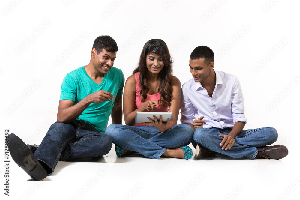 Group of Indian friends using modern technology. Group of Indian friends using modern technology.