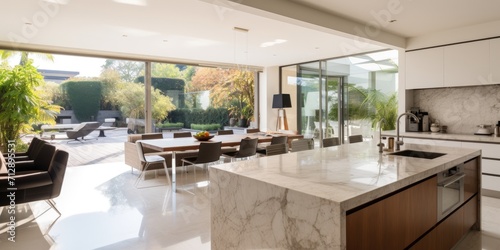 Luxurious modern cube house with open plan kitchen and antique table, marble top kitchen island.