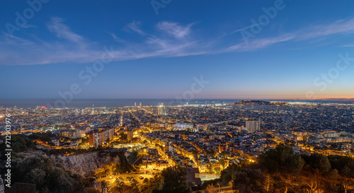 The skyline of Barcelona in Spain at twilight