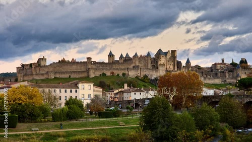 Carcassonne, day to night timelapse showing the famous castle and walled city illimunated at night. France photo