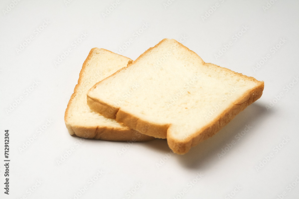 slice of bread 2 served on a white plate, isolated