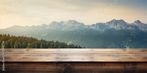 Mountain landscape on wooden table top.