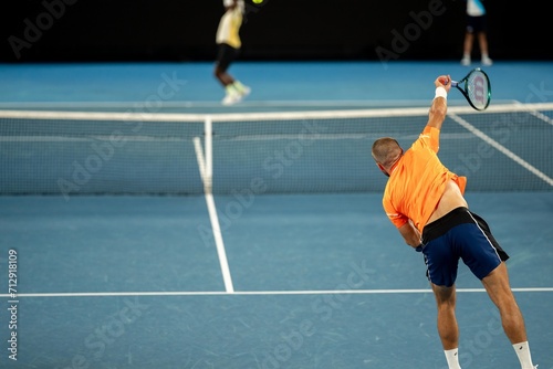 playing a tennis match at the australian open in summer © William