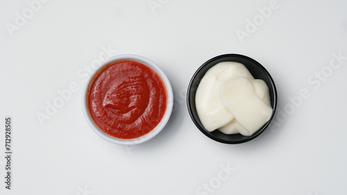 three sauces ketchup mayonnaise, sweet soy sauce and chili sauce in black bowl isolated on white background