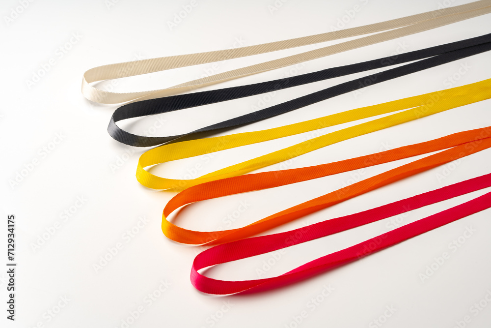 Row of colorful lace strings on white background Row of colorful lace strings on white background