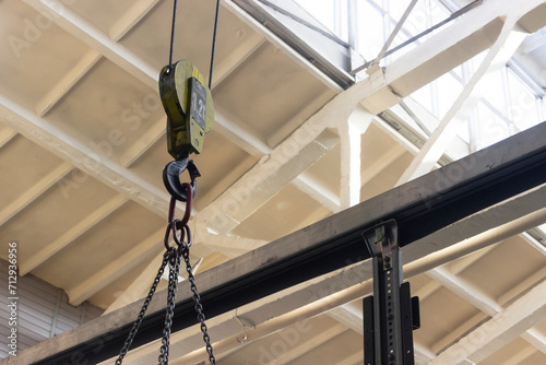 Crane beam hook with chain slings photo