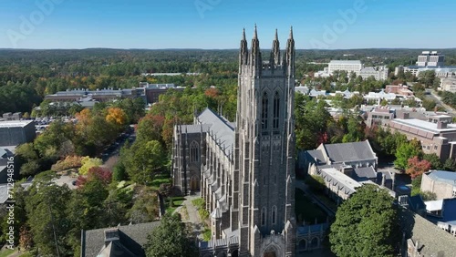 Duke University Chapel. Aerial orbit around prestigious stone building on college campus building in Durham, North Carolina. photo