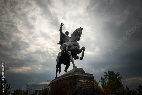 Statue of the legendary Tamerlane Amir Temur on Horseback in Tashkent, Uzbekistan. Dramatic clouds photo