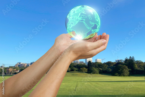 Environment Earth Day In the hands holding green earth on Background, Saving environment, and environmentally sustainable. Save Earth. Concept of the Environment World Earth Day.