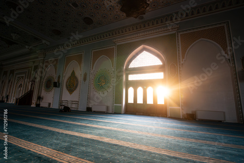 Interior of Hazrati Imam mosque with blue traditional carpet. inside mosque